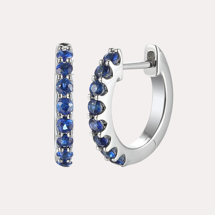 Claw Set Blue Sapphire Huggies In 18K Gold - The Jewelyst. - Claw Set Blue Sapphire Huggies In 18K Gold