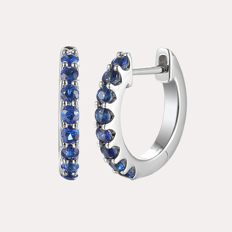 Claw Set Blue Sapphire Huggies In 18K Gold - The Jewelyst. - Claw Set Blue Sapphire Huggies In 18K Gold
