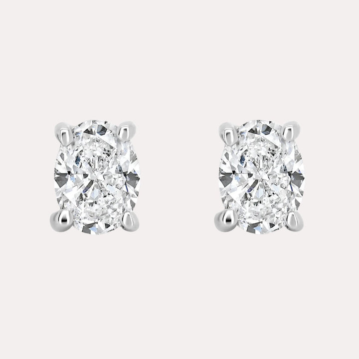 Oval 4 Claw Diamond Stud Earrings In 18K Gold - The Jewelyst. - Oval 4 Claw Diamond Stud Earrings In 18K Gold