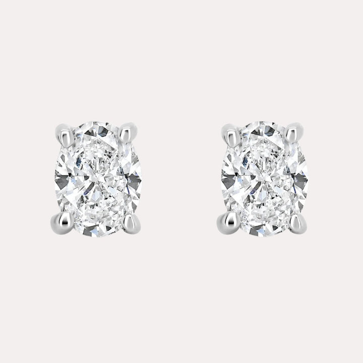 Oval 4 Claw Diamond Stud Earrings In 18K Gold - The Jewelyst. - Oval 4 Claw Diamond Stud Earrings In 18K Gold
