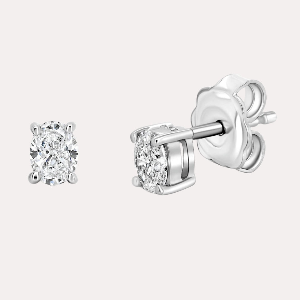Oval 4 Claw Diamond Stud Earrings In 18K Gold - The Jewelyst. - Oval 4 Claw Diamond Stud Earrings In 18K Gold