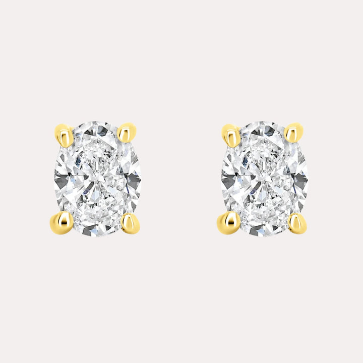 Oval 4 Claw Diamond Stud Earrings In 18K Gold - The Jewelyst. - Oval 4 Claw Diamond Stud Earrings In 18K Gold