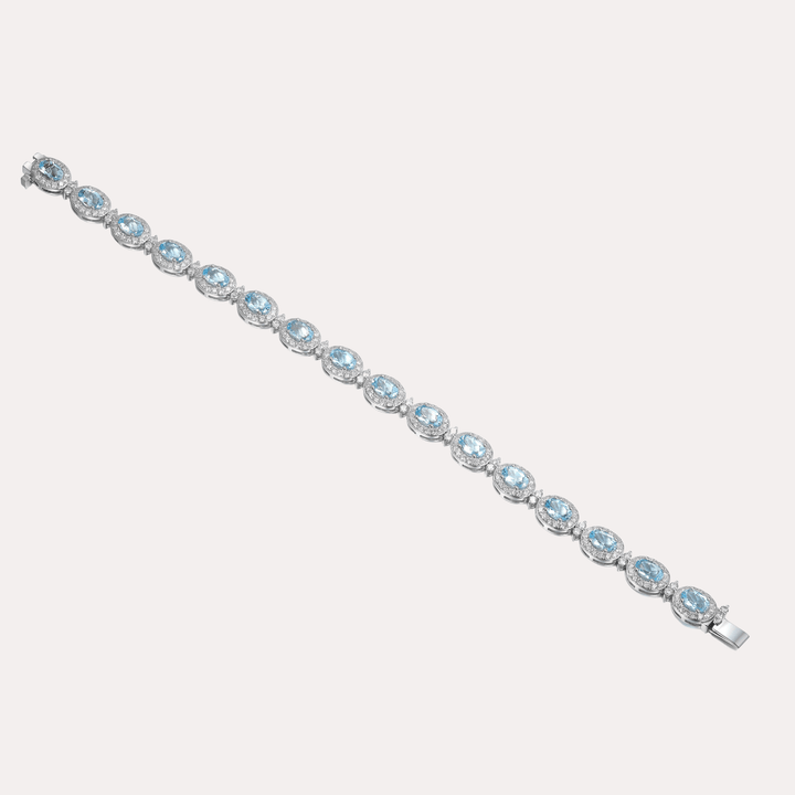 Oval Cut Aquamarine & Diamond Halo Tennis Bracelet In 18K Gold - The Jewelyst. - Oval Cut Aquamarine & Diamond Halo Tennis Bracelet In 18K Gold