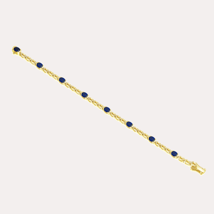 Oval Cut Blue Sapphire Rubover Set Tennis Bracelet In 18K Gold - The Jewelyst. - Oval Cut Blue Sapphire Rubover Set Tennis Bracelet In 18K Gold