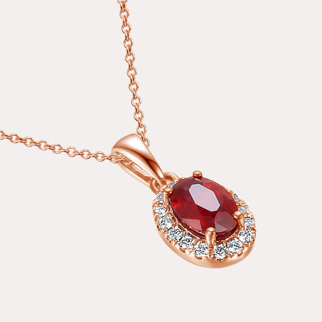 Oval Ruby With Claw Set Diamond Halo Pendant Necklace In 18K Gold - The Jewelyst. - Oval Ruby With Claw Set Diamond Halo Pendant Necklace In 18K Gold