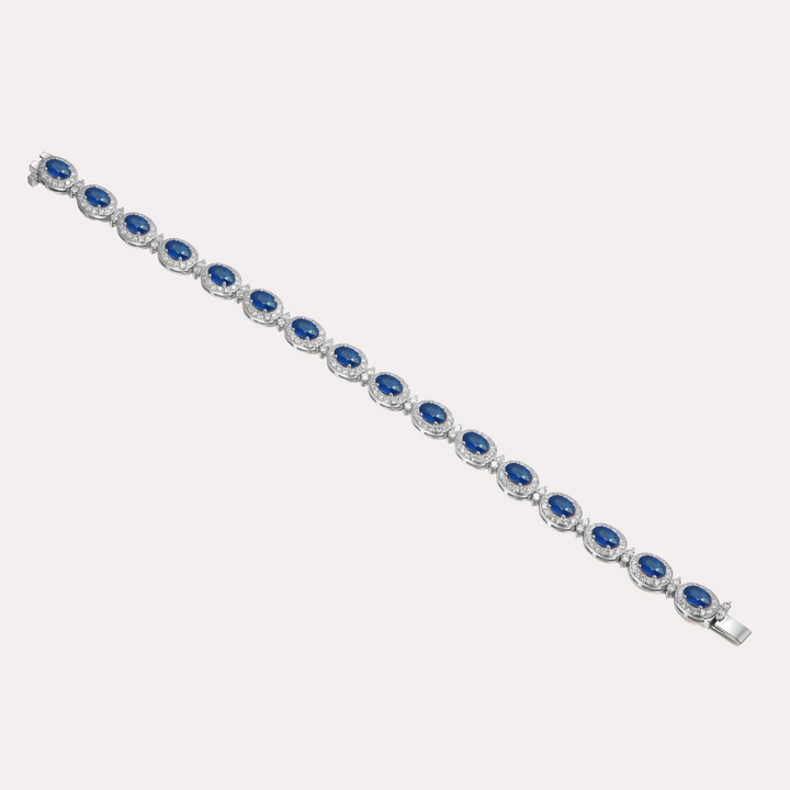 Oval Cut Blue Sapphire & Diamond Halo Tennis Bracelet In 18K Gold
