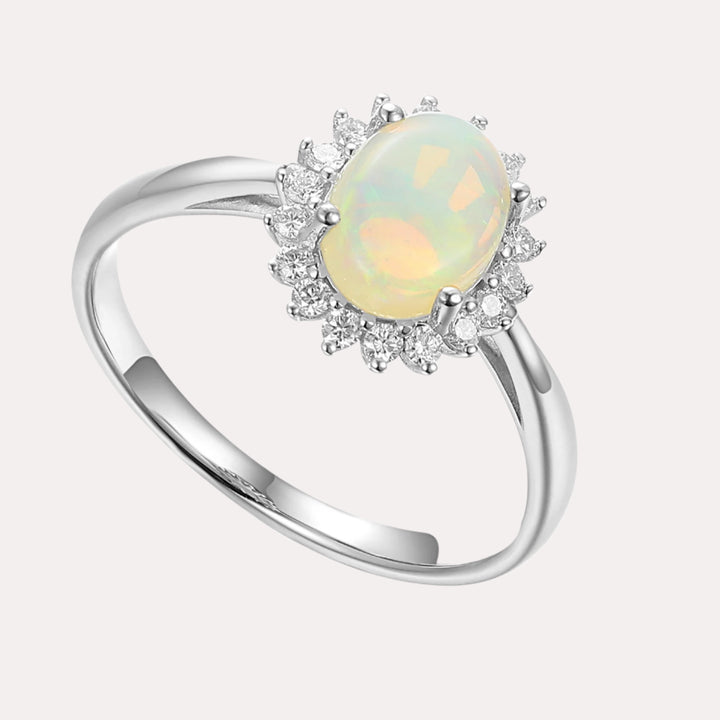 Oval Opal With Round Brilliant Cut Diamond Cluster Halo Ring
