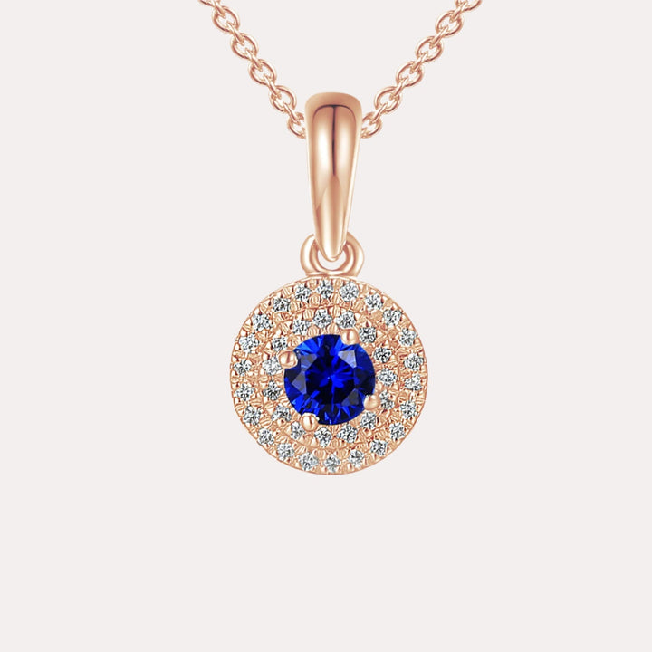 Blue Sapphire and diamond double halo pendant necklace in 18K rose gold