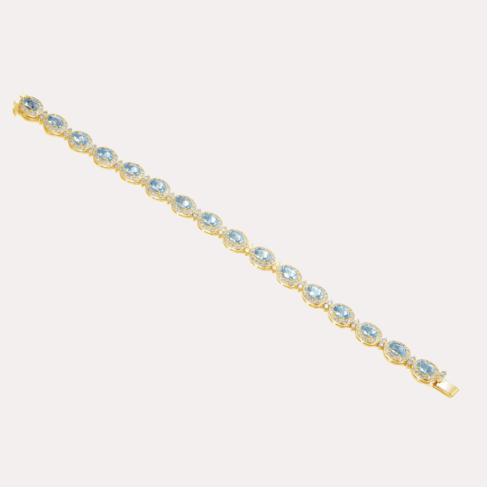 Oval Cut Aquamarine & Diamond Halo Tennis Bracelet In 18K Gold - The Jewelyst. - Oval Cut Aquamarine & Diamond Halo Tennis Bracelet In 18K Gold