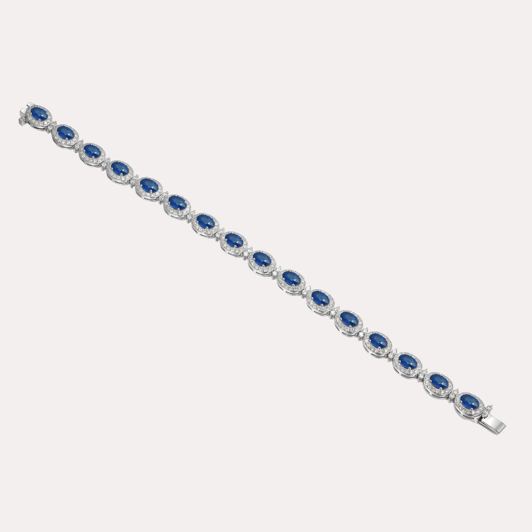 Oval Cut Blue Sapphire & Diamond Halo Tennis Bracelet In 18K Gold - The Jewelyst. - Oval Cut Blue Sapphire & Diamond Halo Tennis Bracelet In 18K Gold