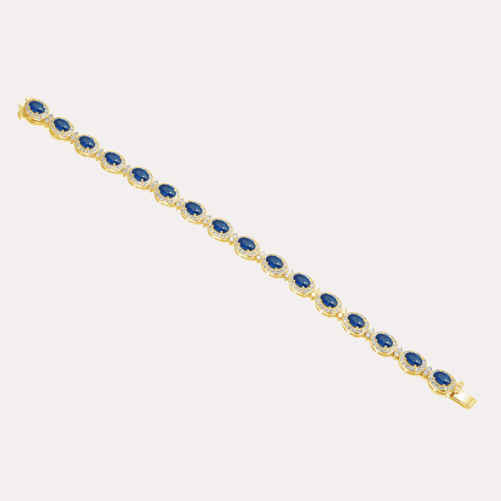 Oval Cut Blue Sapphire & Diamond Halo Tennis Bracelet In 18K Gold - The Jewelyst. - Oval Cut Blue Sapphire & Diamond Halo Tennis Bracelet In 18K Gold