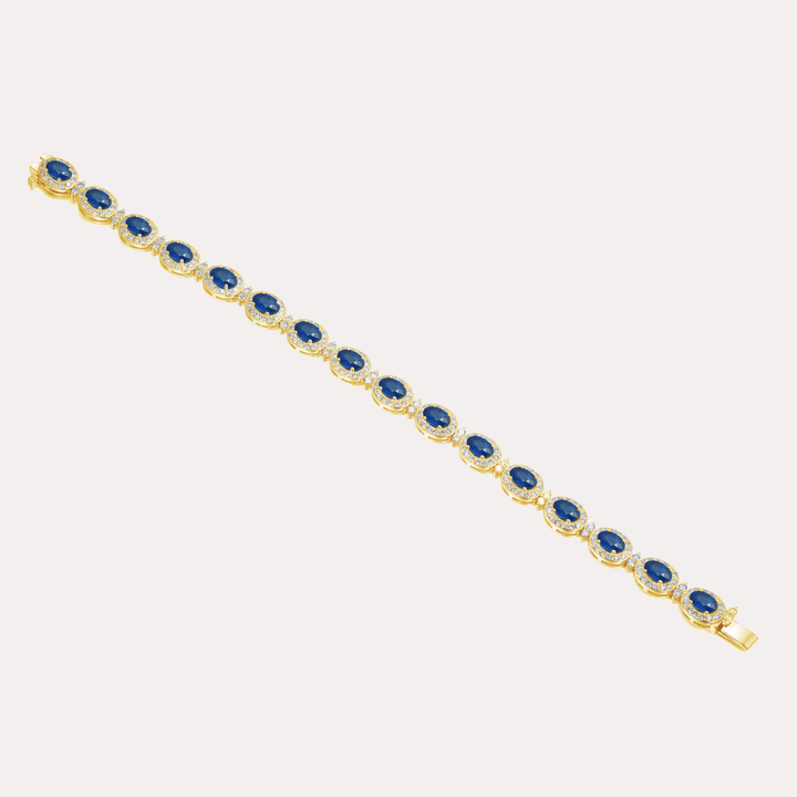 Oval Cut Blue Sapphire & Diamond Halo Tennis Bracelet In 18K Gold - The Jewelyst. - Oval Cut Blue Sapphire & Diamond Halo Tennis Bracelet In 18K Gold