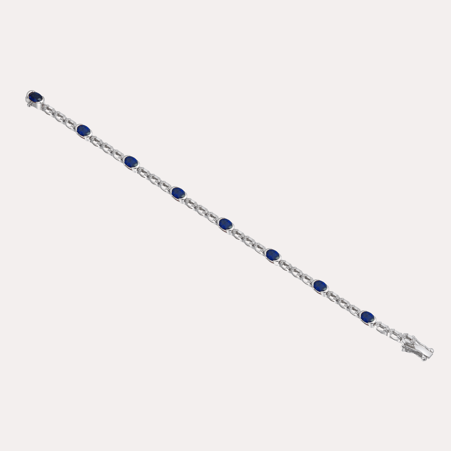 Oval Cut Blue Sapphire Rubover Set Tennis Bracelet In 18K Gold - The Jewelyst. - Oval Cut Blue Sapphire Rubover Set Tennis Bracelet In 18K Gold