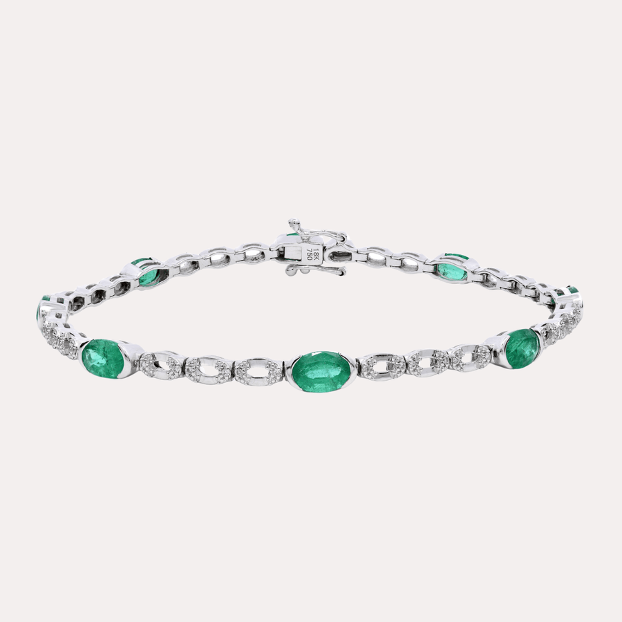 Oval Cut Emerald Rubover Set Tennis Bracelet In 18K Gold - The Jewelyst. - Oval Cut Emerald Rubover Set Tennis Bracelet In 18K Gold