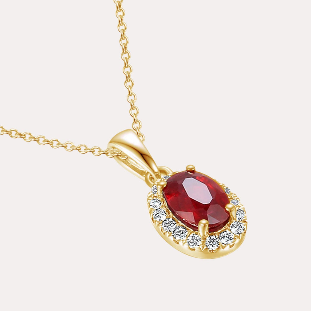 Oval Ruby With Claw Set Diamond Halo Pendant Necklace In 18K Gold - The Jewelyst. - Oval Ruby With Claw Set Diamond Halo Pendant Necklace In 18K Gold