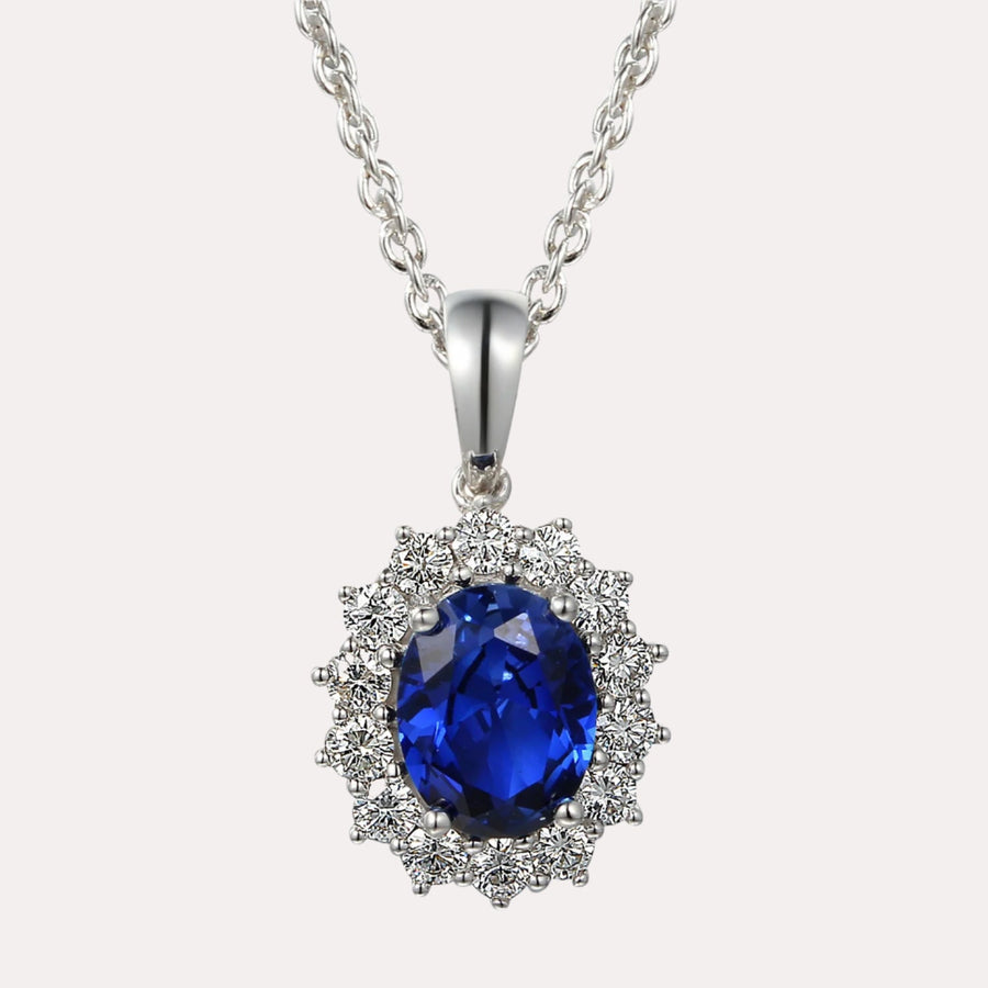 Oval Shape Blue Sapphire Halo Cluster Pendant Necklace In 18K Gold - The Jewelyst. - Oval Shape Blue Sapphire Halo Cluster Pendant Necklace In 18K Gold